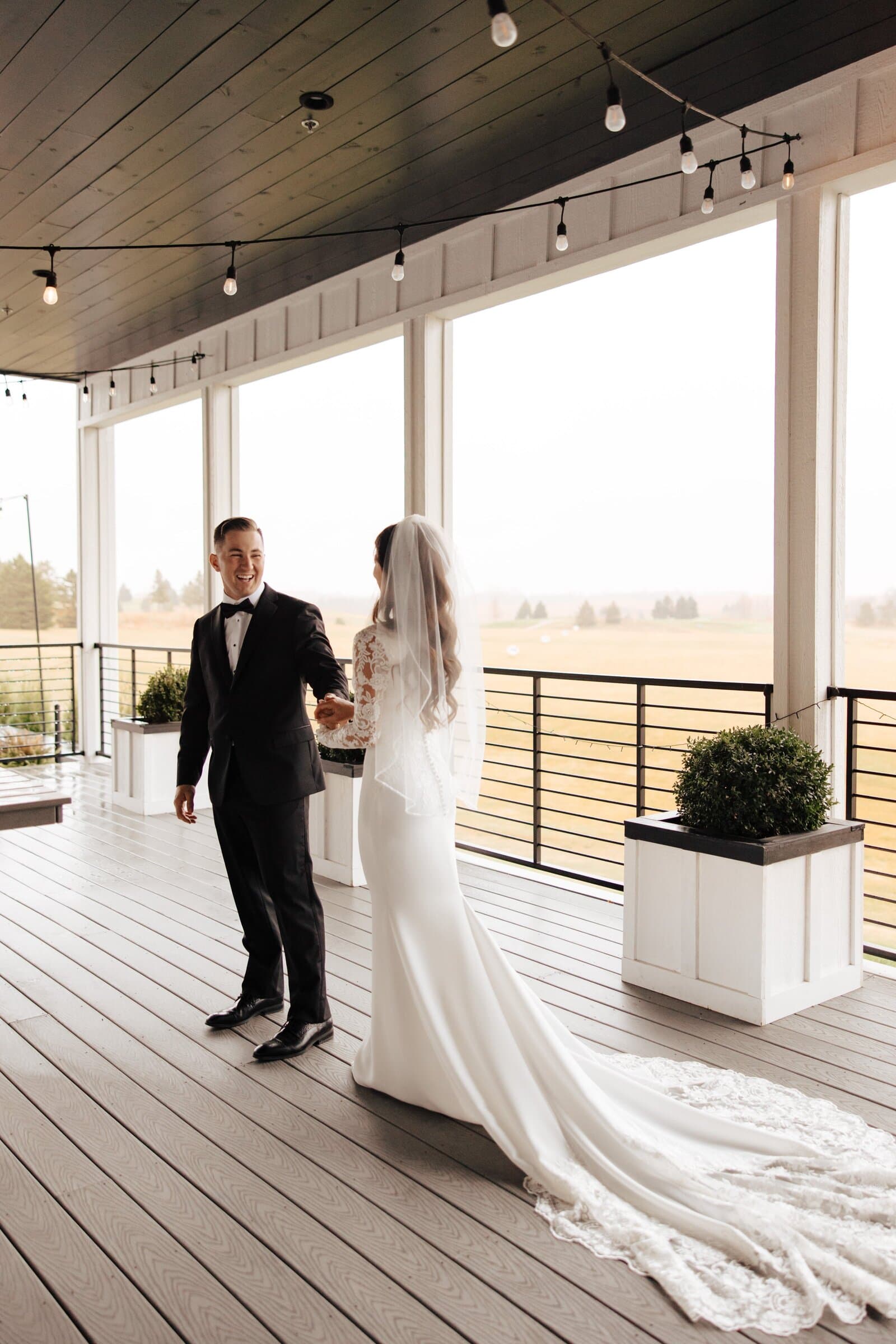 Wedding couple in designer attire — real Minnesota bride and groom from Bridal Aisle Boutique