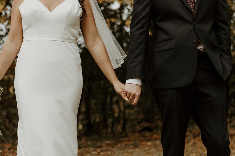 Bride trying on designer wedding gown during bridal appointment at Bridal Aisle Boutique, Osseo MN