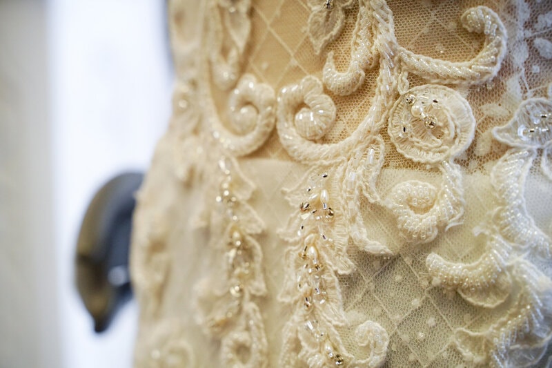 Bride during affordable budget bridal appointment — designer wedding dresses under $600, Minnesota