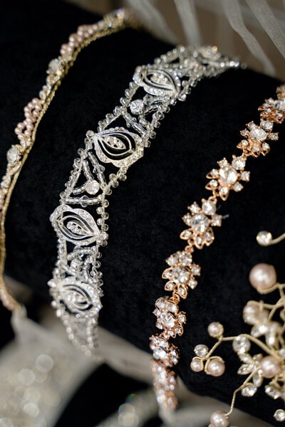 Bride trying on wedding veils and accessories — styling appointment at Bridal Aisle Boutique MN