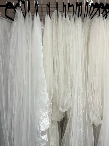 Close-up of designer wedding gown detail — affordable designer dresses near Maple Grove MN