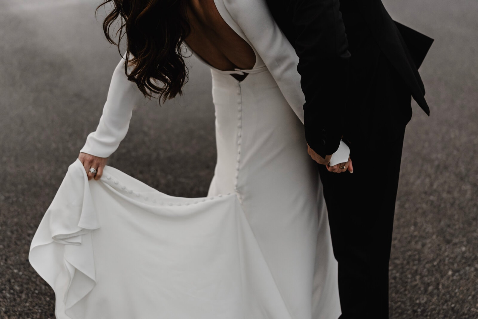 Happy Minnesota bride and groom in designer wedding attire from Bridal Aisle Boutique, Osseo MN