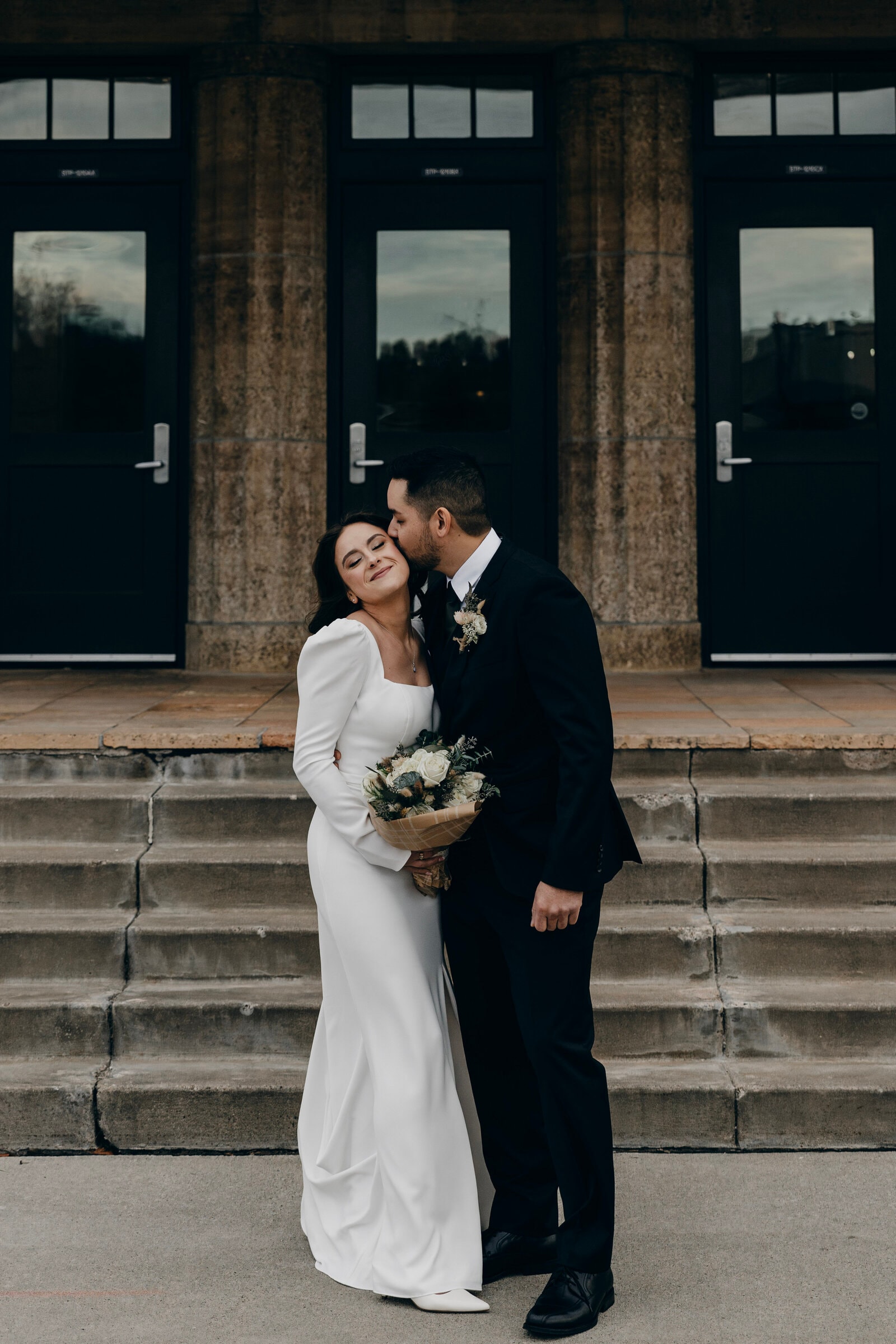 Bride in off-the-rack designer wedding dress from Bridal Aisle Boutique — wedding dress shopping Minnesota